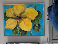 Framed acrylic painting on wall