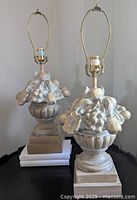Front view of both fruit bowl motif table lamps