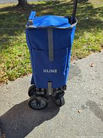 Wagon folded upright showing blue fabric body with ULINE logo
