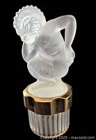 Front view of Lalique Faune Mascot perfume bottle showing frosted faun stopper and ribbed base