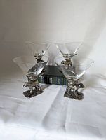 All four monkey martini glasses front view