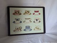 Front view of one placemat showing teacup design and border