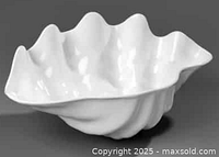 Top view of one white melamine clam bowl