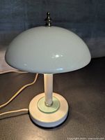 Front view of white dome-shade UFO lamp