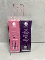 Back view of both sealed Starbuzz E-Hose boxes showing contents list and colors