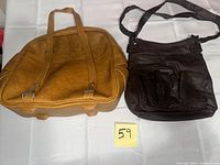 Overview of both handbags side by side on table