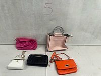 Front view of all five small purses