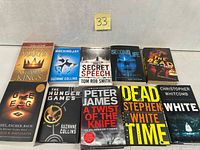All ten books laid out front covers visible