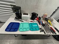 Overall view of appliances, trays and utensils