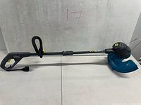 Full view of Yardworks corded electric string trimmer showing handle, shaft and guard