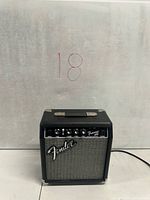 Front view of Fender Frontman 10G showing control panel, grille and logo