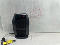 Front view of Honeywell HeatGenius heater with power cord
