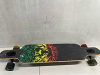 Top view of longboard showing grip tape and rear/front wheel colours