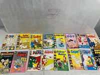 Row of 15 Harvey Comics titles including Casper, Spooky, Richie Rich etc.