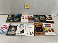 All 13 books laid out cover up on floor