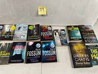 All 11 paperback novels laid out showing front covers and titles