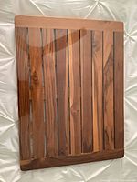 Front view of bamboo slatted bath mat