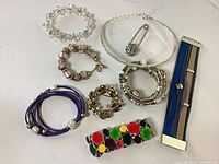 All nine costume jewelry pieces laid out