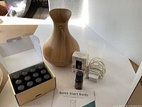 Overall lot with diffuser, oils box, adapter, measuring cup and guide