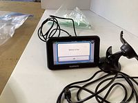 GPS unit powered on showing menu screen with battery message