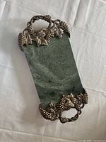 Full view of rectangular green marble tray with pewter grapevine handles