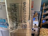 Cardboard box side showing printed text and sealed condition