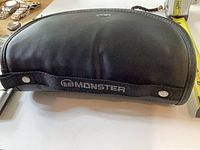 Closed black Monster zippered case showing overall shape and fullness