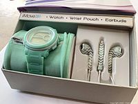 boxed set showing watch, pouch, earbuds