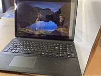 Front view open laptop displaying screen and keyboard