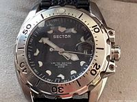 Front view of Sector diver watch displaying dial, bezel, and strap