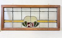 Full view of rectangular stained glass panel in wooden frame