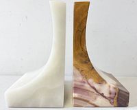 Side profile of both bookends showing contrasting colors and curved design