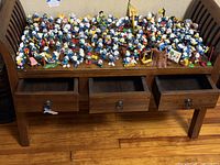 Full view of wooden bench with drawers open