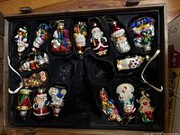 Tray containing roughly 15 glass figural ornaments