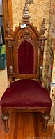 Full front view of carved wood chair