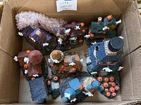 Box overview showing nine resin Halloween village pieces