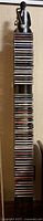 Full height view of CD tower fully loaded with discs