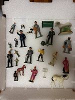 Group shot of all figures arranged in packing foam