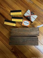Group view of all vintage boxes on wood floor