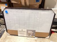 Front view of packaged 3-in-1 dry erase calendar board