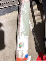 Rolled, factory-sealed IKEA HEMMAHOS play tent package