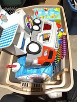 Overall lot showing plastic truck, abacus, box of blocks