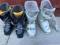 Both pairs of ski boots side by side