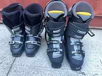 Front view of both Salomon and Nordica ski boot pairs