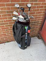 Full view of golf bag filled with clubs