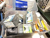 Overall view of tote with mixed hardware boxes and coil nails