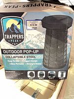Front of box showing Trappers Peak collapsible stool image and branding
