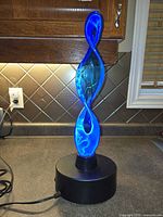 Lamp on countertop illuminated showing blue plasma effect