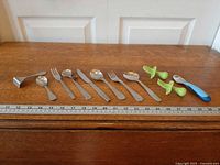 Full set laid out with ruler for scale