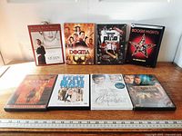 Eight DVD cases front view showing all titles